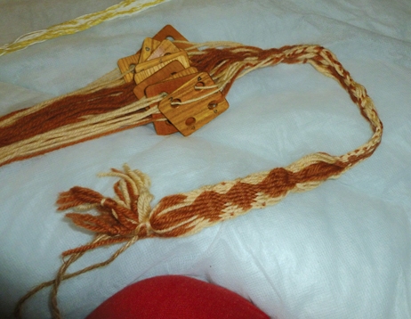 Tablet weaving braid: used as decoration and as belts in C16th and earlier. This example from Weald and Downland Museum.
: WECS visit 2012.